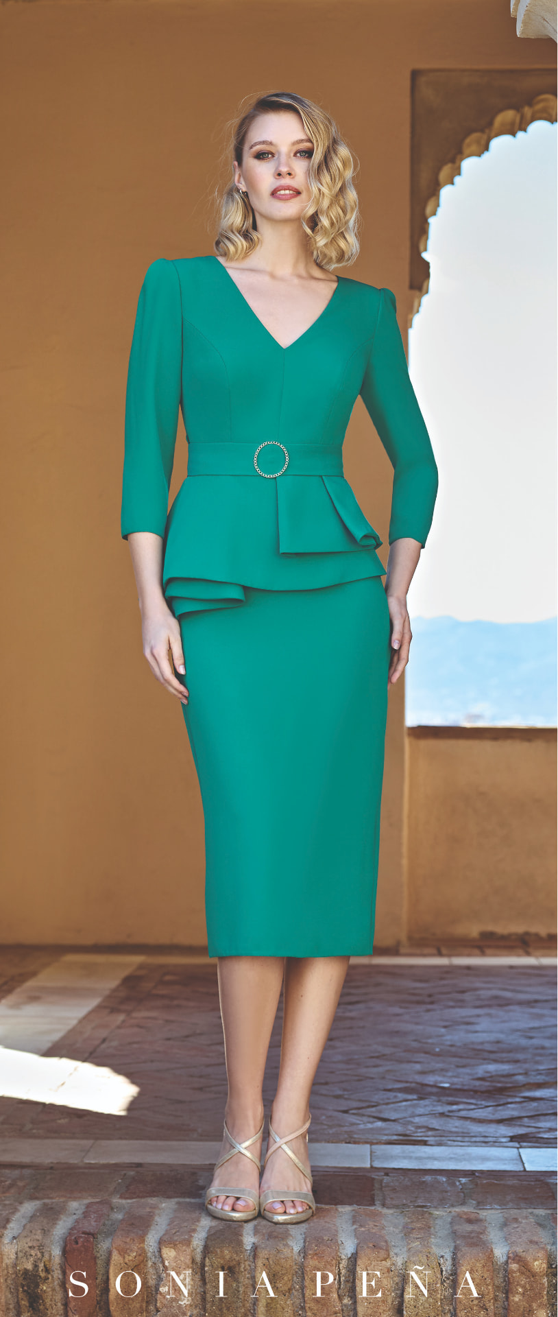 Emerald green peplum pencil dress with crystal buckle belt