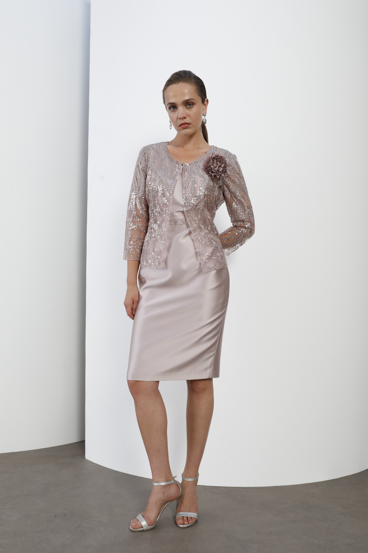 Rose gold embellished lace jacket over satin dress