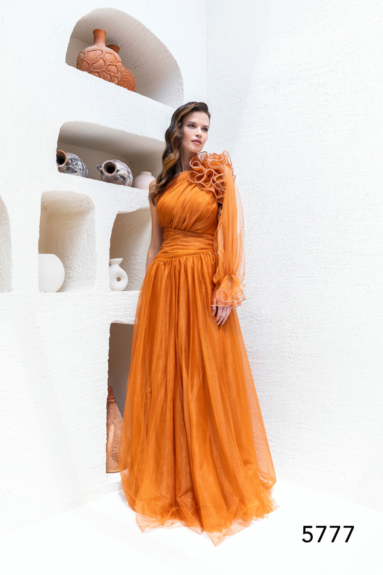 Burnt orange one-shoulder tulle gown with ruffle detail