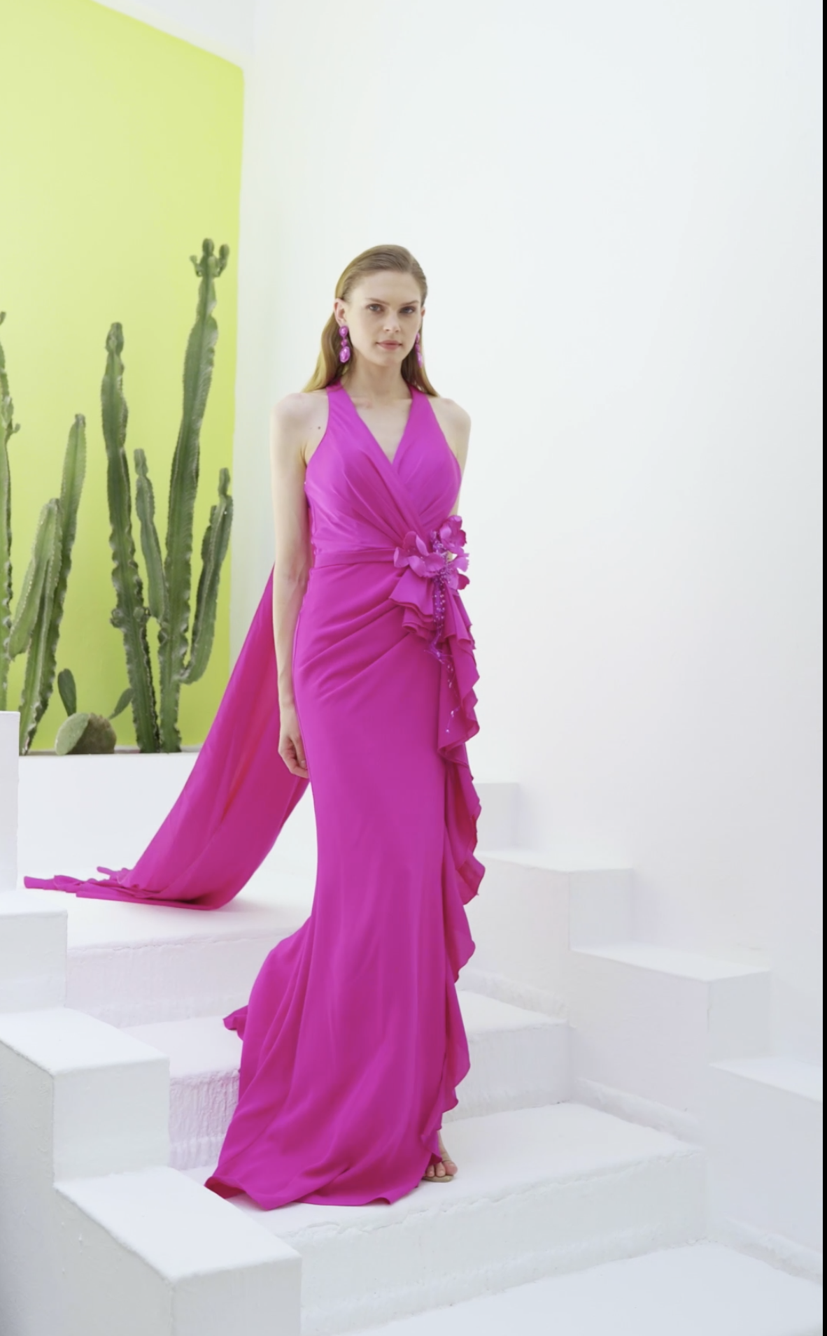 Fuchsia halter chiffon gown with floral appliqué waist and flowing train