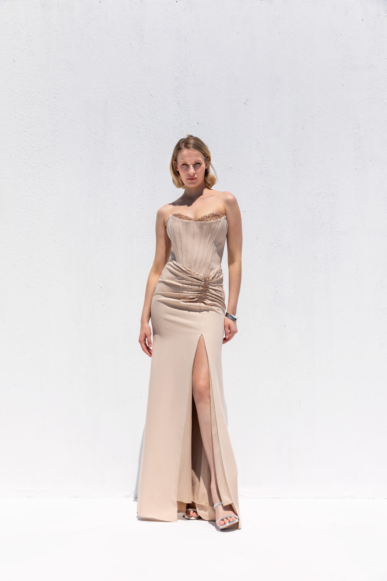 Champagne strapless corset gown with beaded neckline and front slit